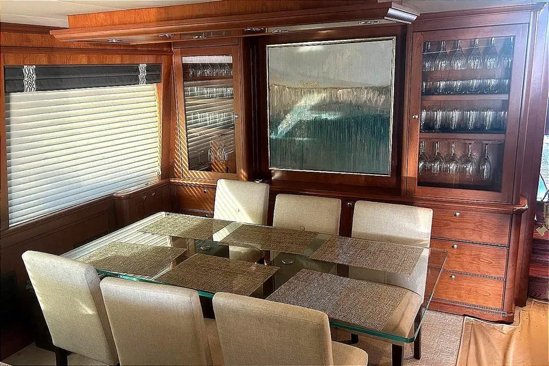 Harbor Lady Yacht Photos Pics Luxurious dining area in a 2005 Pacific Mariner Raised Pilothouse Motoryacht with elegant wood finishes.
