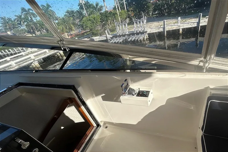 Harbor Lady Yacht Photos Pics 2005 Pacific Mariner Raised Pilothouse Motoryacht interior with control panel and waterfront view.