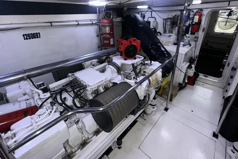 Harbor Lady Yacht Photos Pics Engine room of 2005 Pacific Mariner Raised Pilothouse Motoryacht, featuring machinery and equipment.