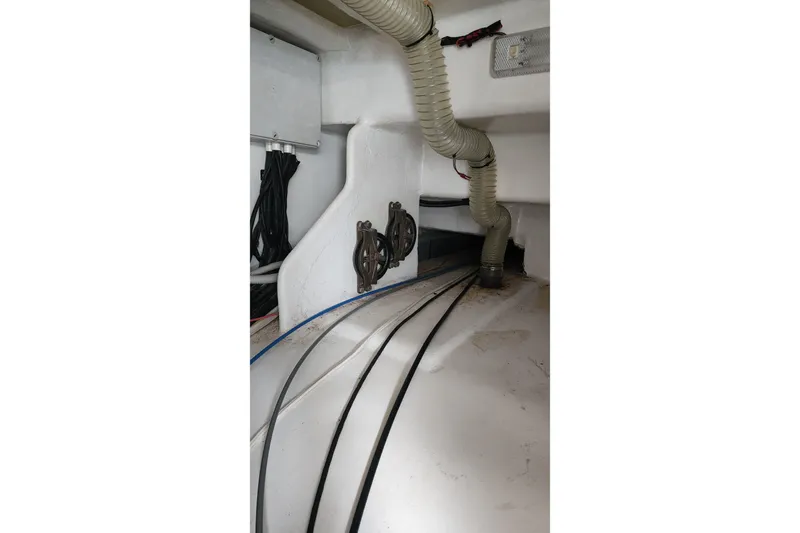 Conquest Yacht Photos Pics Engine room of 2006 Maxim Yachts 57, featuring hoses and wiring.