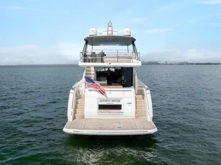 Definite Maybe Yacht Photos Pics 2019 Princess F70 yacht on open water, rear view with American flag.