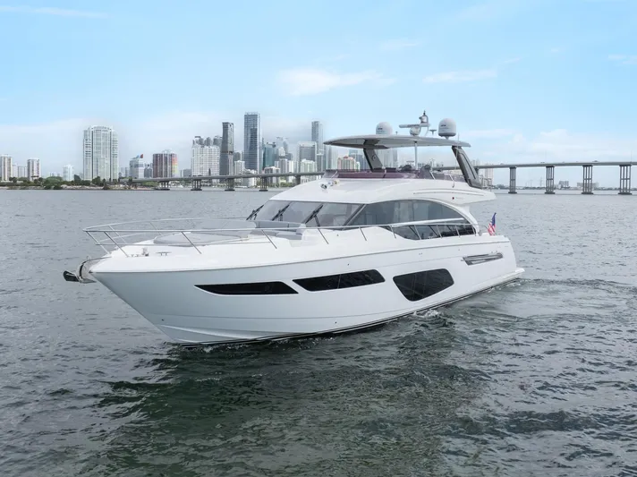 Definite Maybe Yacht Photos Pics 2019 Princess F70 yacht cruising near city skyline and bridge.