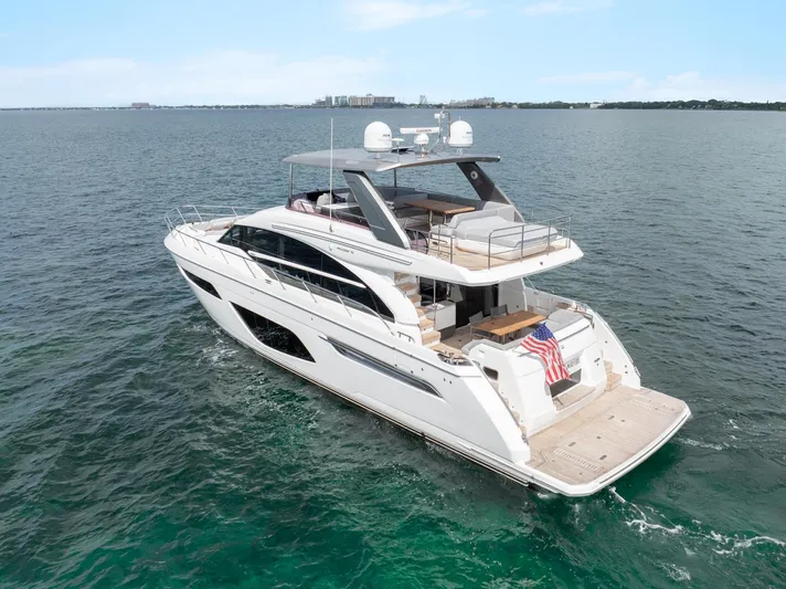 Definite Maybe Yacht Photos Pics Luxurious 2019 Princess F70 yacht cruising on open water, showcasing elegant design and spacious deck.