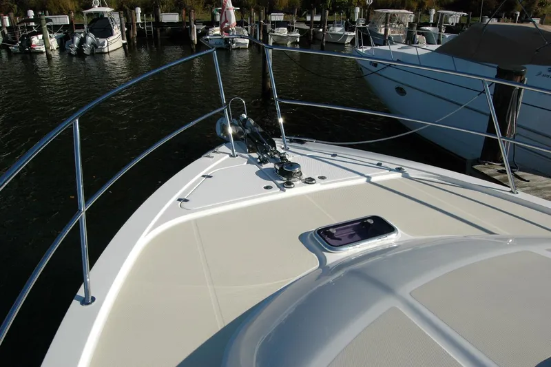 Serendipity Yacht Photos Pics 2019 Sabre 38 Salon Express yacht bow at marina, featuring sleek design and railing.