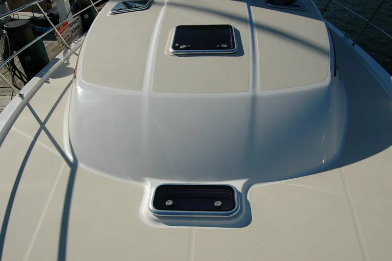 Serendipity Yacht Photos Pics 2019 Sabre 38 Salon Express yacht deck with hatches and railing.
