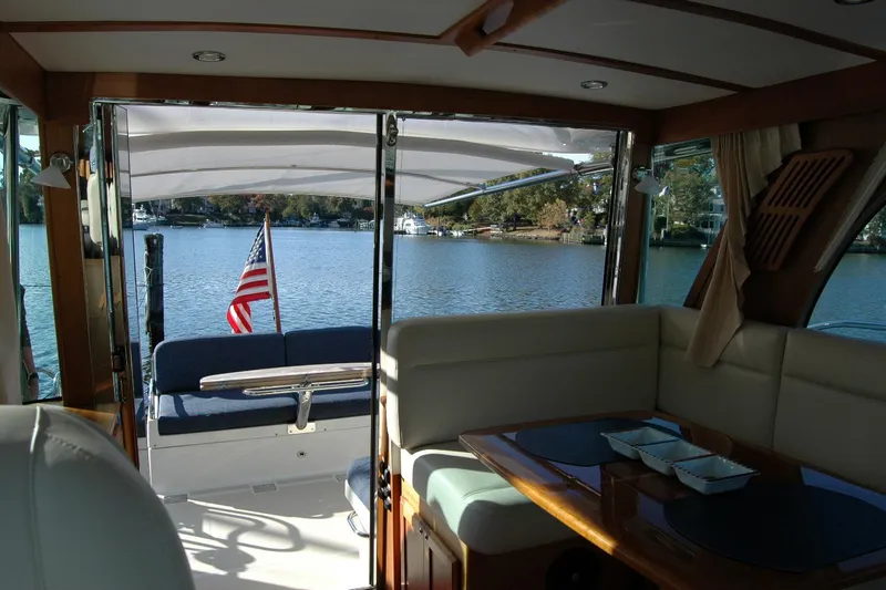 Serendipity Yacht Photos Pics Interior view of 2019 Sabre 38 Salon Express yacht with lake backdrop.