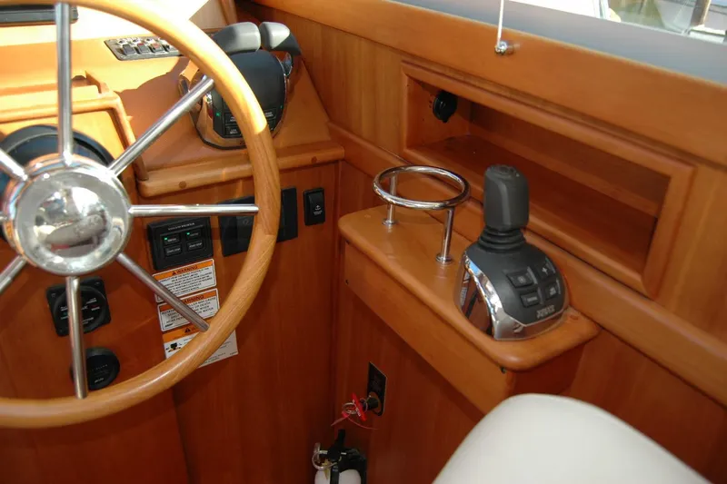 Serendipity Yacht Photos Pics 2019 Sabre 38 Salon Express helm with wooden steering wheel and control panel.
