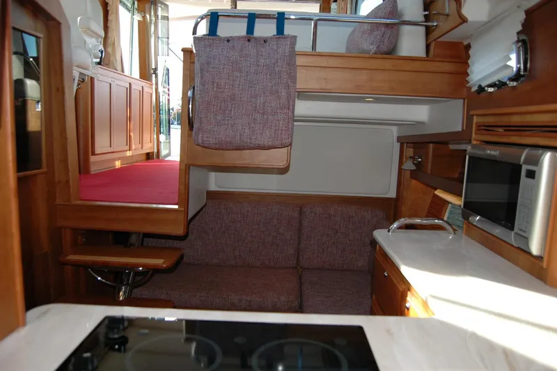 Serendipity Yacht Photos Pics Interior of 2019 Sabre 38 Salon Express yacht with modern kitchen and seating area.