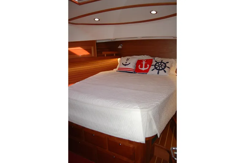 Serendipity Yacht Photos Pics Cozy bedroom in 2019 Sabre 38 Salon Express with nautical-themed pillows.