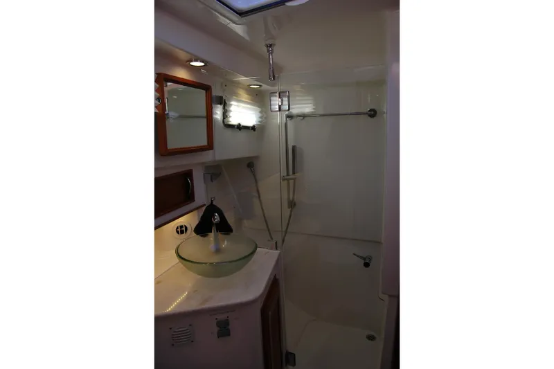 Serendipity Yacht Photos Pics 2019 Sabre 38 Salon Express bathroom with glass sink and shower.