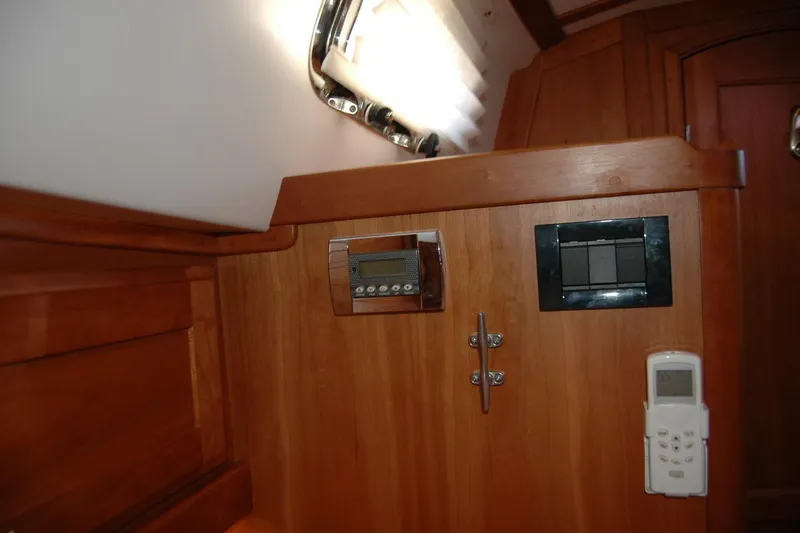Serendipity Yacht Photos Pics Interior of 2019 Sabre 38 Salon Express with wooden paneling and control panels.