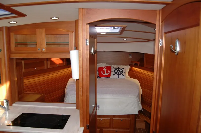 Serendipity Yacht Photos Pics Interior of 2019 Sabre 38 Salon Express yacht, featuring cozy wooden cabin and nautical decor.