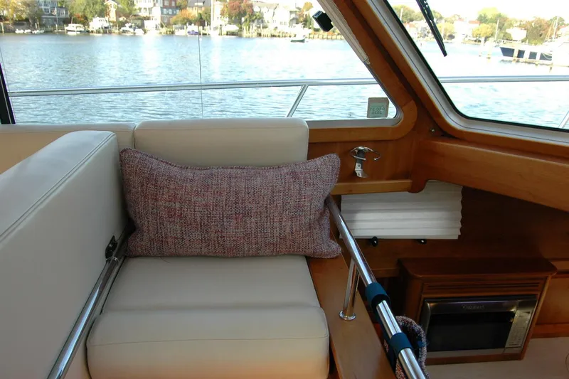 Serendipity Yacht Photos Pics Interior of 2019 Sabre 38 Salon Express yacht with comfortable seating and scenic water view.