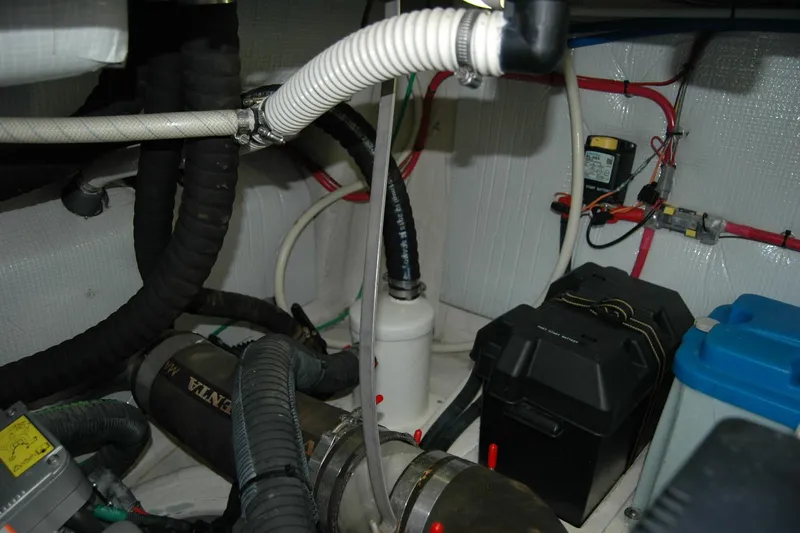 Serendipity Yacht Photos Pics Engine room of 2019 Sabre 38 Salon Express with various hoses and equipment.