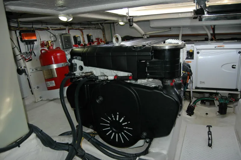 Serendipity Yacht Photos Pics Engine room of 2019 Sabre 38 Salon Express with visible machinery and fire extinguisher.