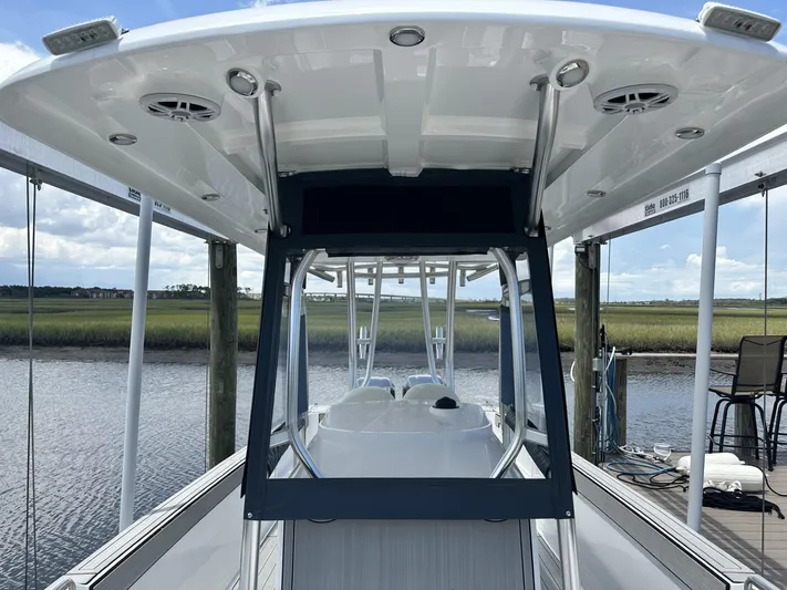  Yacht Photos Pics Custom Shark Fin R321 boat docked by a serene river, 2023 model.