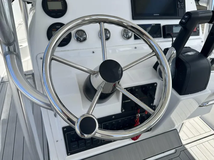  Yacht Photos Pics Steering wheel and controls of 2023 Custom Shark Fin R321 boat.