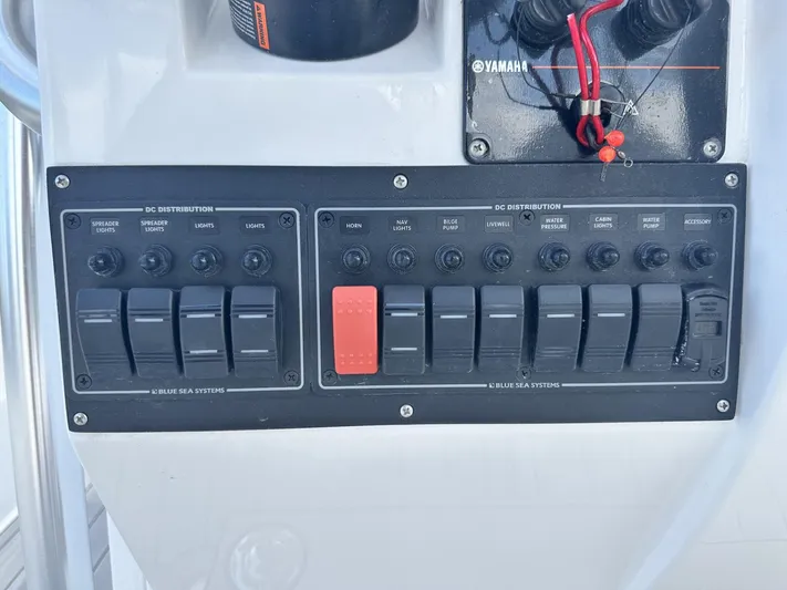  Yacht Photos Pics Control panel of a 2023 Custom Shark Fin R321 boat with switches and Yamaha components.