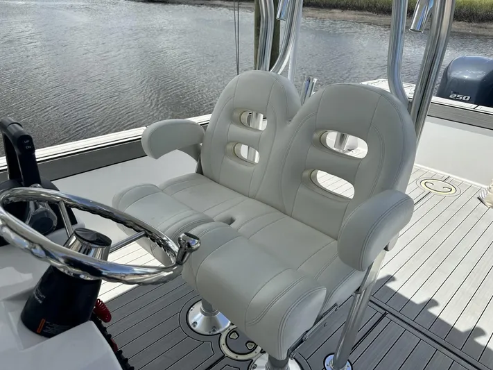 Yacht Photos Pics Luxury boat seating with dual white leather chairs, Custom Shark Fin R321, 2023 model.