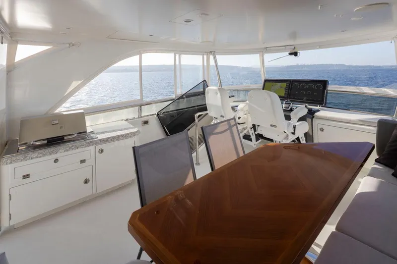 Crescent Moon Yacht Photos Pics Luxurious 2017 Ocean Alexander 70e yacht interior with helm, dining area, and ocean view.