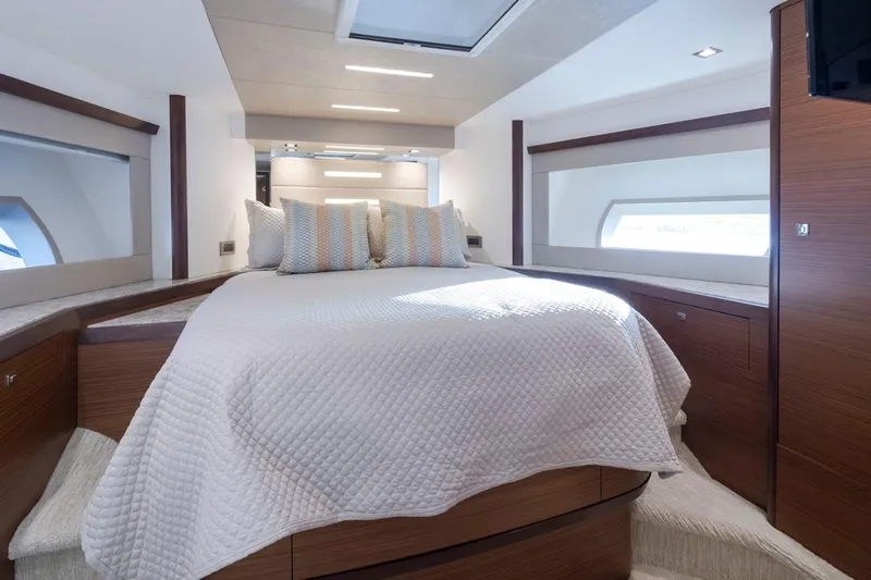 Crescent Moon Yacht Photos Pics Luxurious bedroom interior of 2017 Ocean Alexander 70e yacht with elegant bedding and modern design.