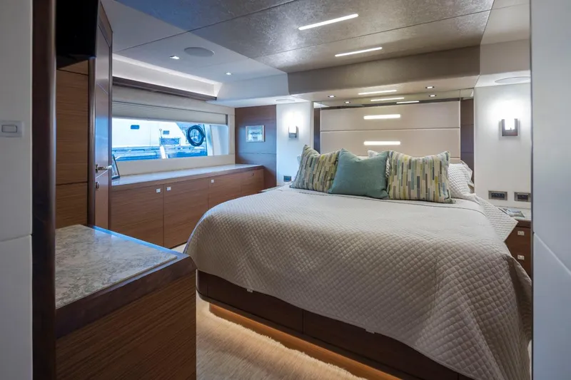 Crescent Moon Yacht Photos Pics Luxurious bedroom interior of 2017 Ocean Alexander 70E Motoryacht with modern design and cozy bedding.