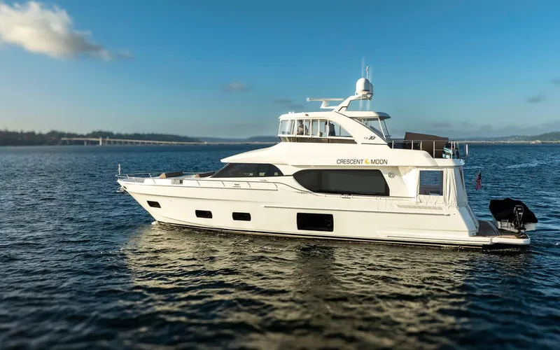 Crescent Moon Yacht Photos Pics 2017 Ocean Alexander 70E Motoryacht cruising on open water under clear skies.