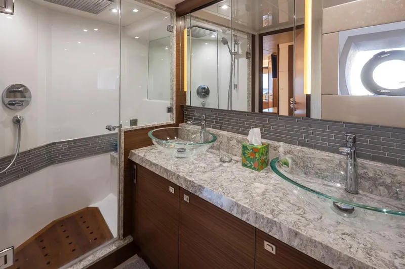 Crescent Moon Yacht Photos Pics Luxurious bathroom in 2017 Ocean Alexander 70E Motoryacht with glass sinks and modern shower.