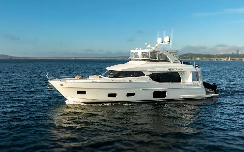 Crescent Moon Yacht Photos Pics 2017 Ocean Alexander 70E Motoryacht cruising on open water under clear skies.