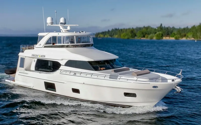 Crescent Moon Yacht Photos Pics 2017 Ocean Alexander 70E Motoryacht cruising on a serene blue lake.