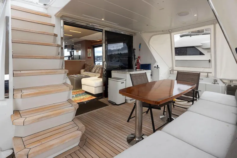 Crescent Moon Yacht Photos Pics 2017 Ocean Alexander 70E Motoryacht interior with seating, table, and stairs.