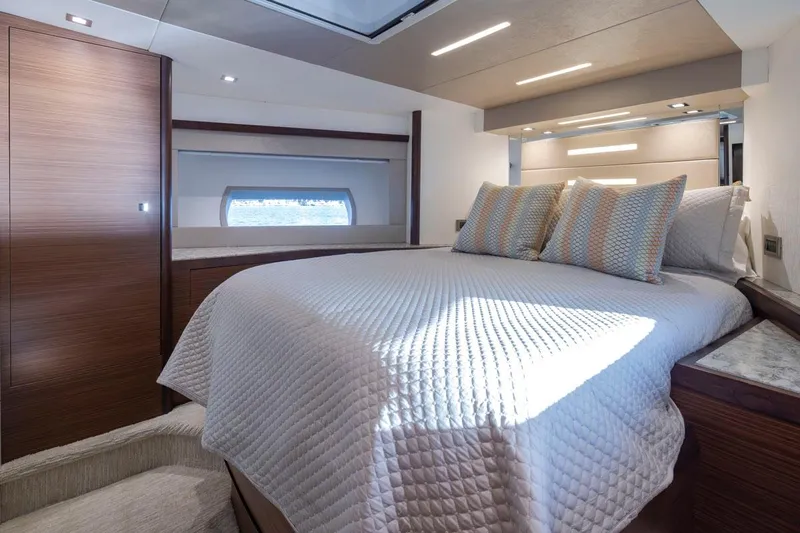 Crescent Moon Yacht Photos Pics Luxurious bedroom interior of 2017 Ocean Alexander 70e yacht with modern design and cozy bedding.