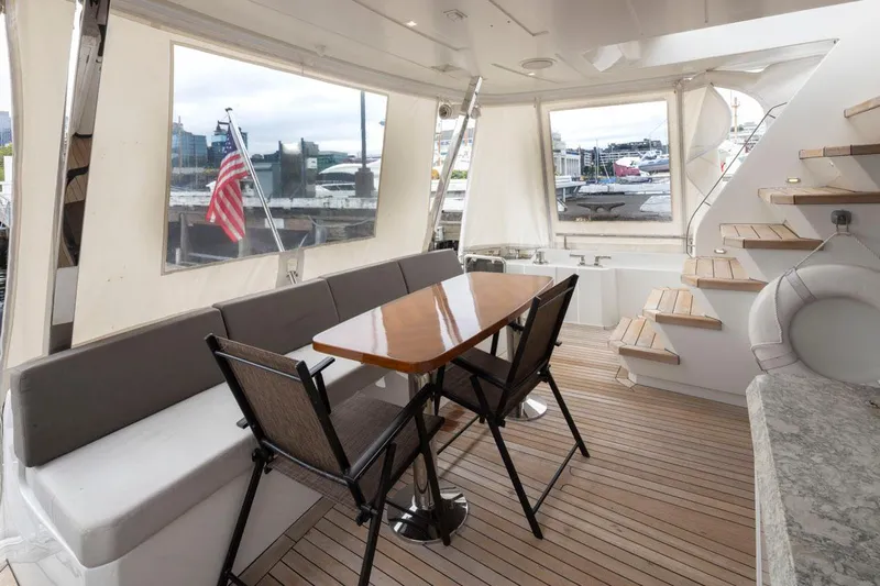 Crescent Moon Yacht Photos Pics Luxurious 2017 Ocean Alexander 70E Motoryacht interior with elegant seating and wooden flooring.