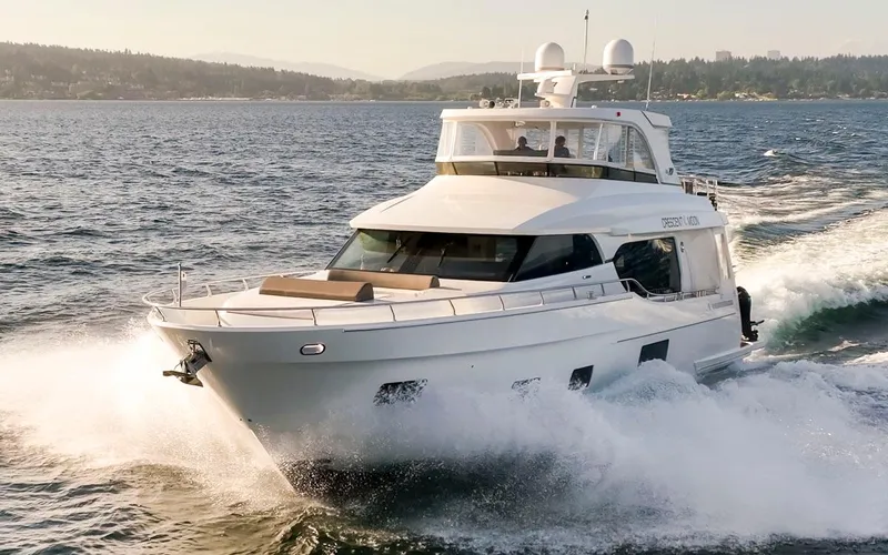 Crescent Moon Yacht Photos Pics 2017 Ocean Alexander 70E Motoryacht cruising on open water, creating waves.