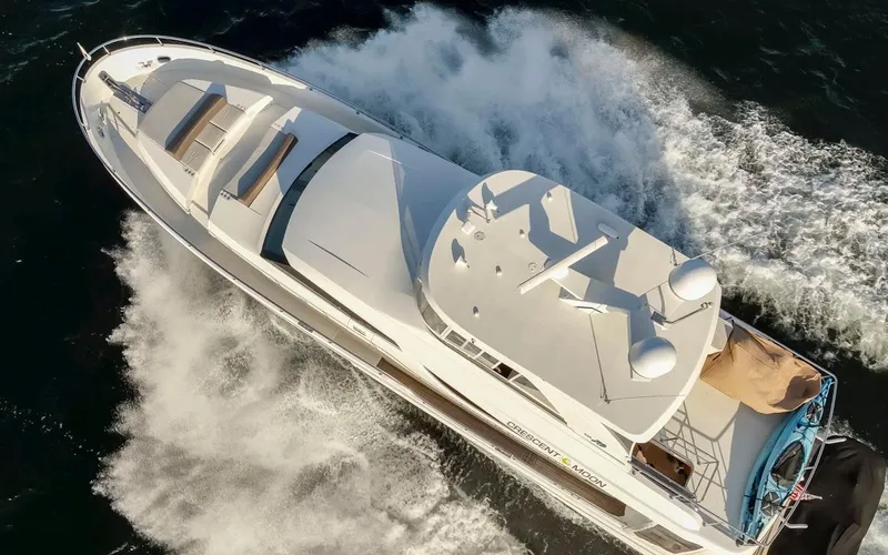 Crescent Moon Yacht Photos Pics 2017 Ocean Alexander 70E Motoryacht cruising on open water, aerial view.