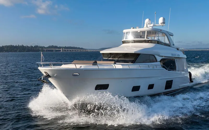 Crescent Moon Yacht Photos Pics 2017 Ocean Alexander 70E Motoryacht cruising on open water, showcasing sleek design and luxury.