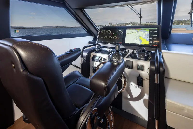 Crescent Moon Yacht Photos Pics 2017 Ocean Alexander 70E Motoryacht helm with leather seat and advanced navigation displays.