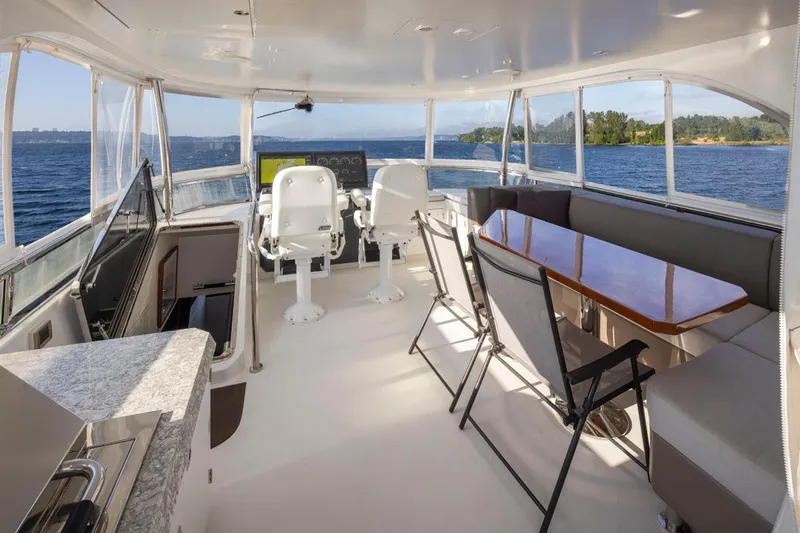 Crescent Moon Yacht Photos Pics Luxurious 2017 Ocean Alexander 70e yacht interior with seating, helm, and ocean view.