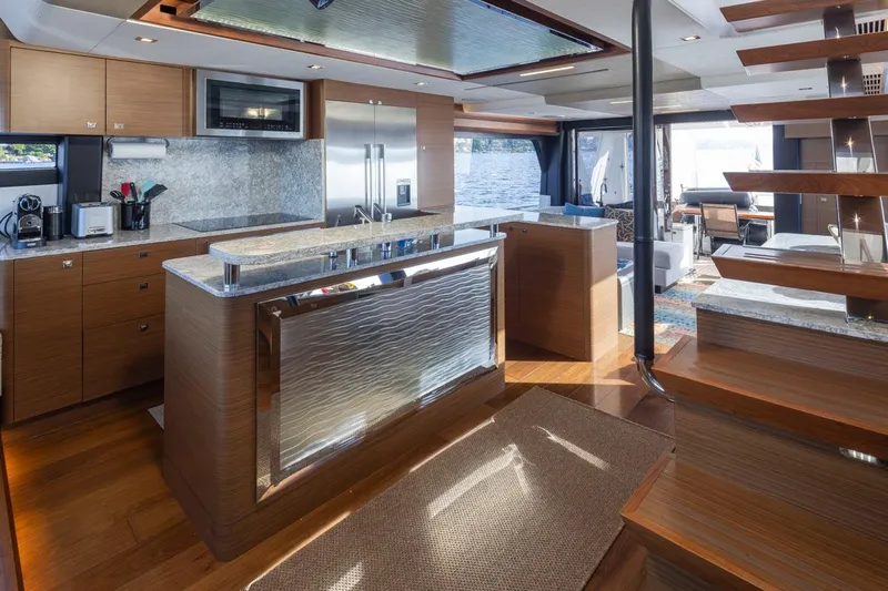 Crescent Moon Yacht Photos Pics Luxurious kitchen interior of 2017 Ocean Alexander 70E Motoryacht with modern amenities and wooden finishes.