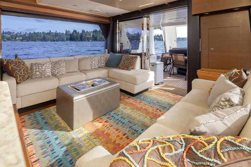 Crescent Moon Yacht Photos Pics Luxurious interior of 2017 Ocean Alexander 70E Motoryacht with plush seating and vibrant decor.