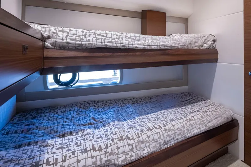 Crescent Moon Yacht Photos Pics Bunk beds in 2017 Ocean Alexander 70e yacht cabin, featuring modern design and window view.
