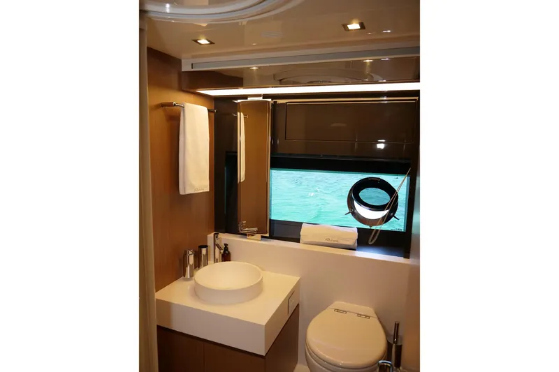  Yacht Photos Pics Luxurious bathroom interior of 2017 Riva 76 Perseo yacht with modern fixtures and ocean view.