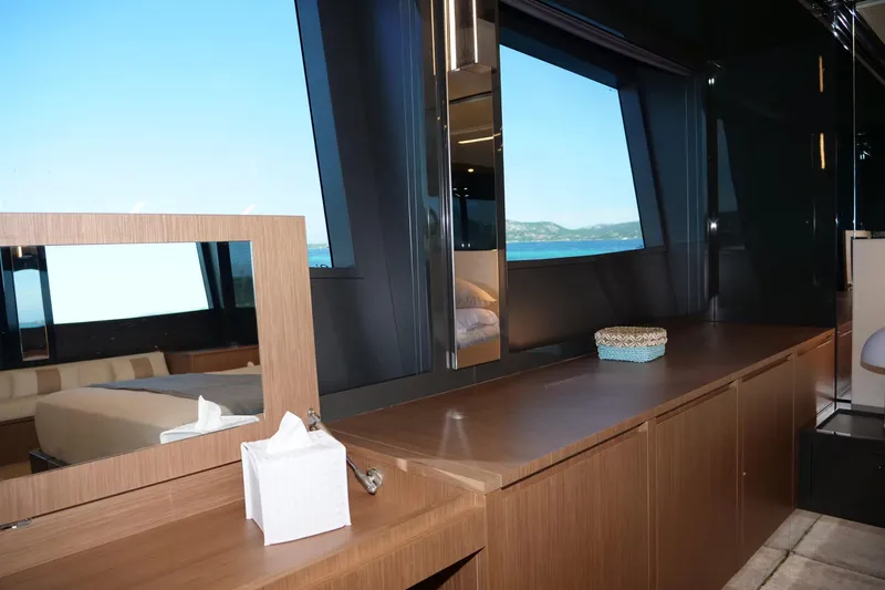  Yacht Photos Pics Luxurious interior of 2017 Riva 76 Perseo yacht with ocean view through large window.