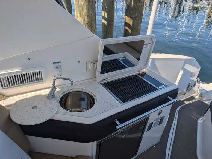  Yacht Photos Pics 2019 Sea Ray Sundancer 320 boat kitchenette with sink and grill by the water.