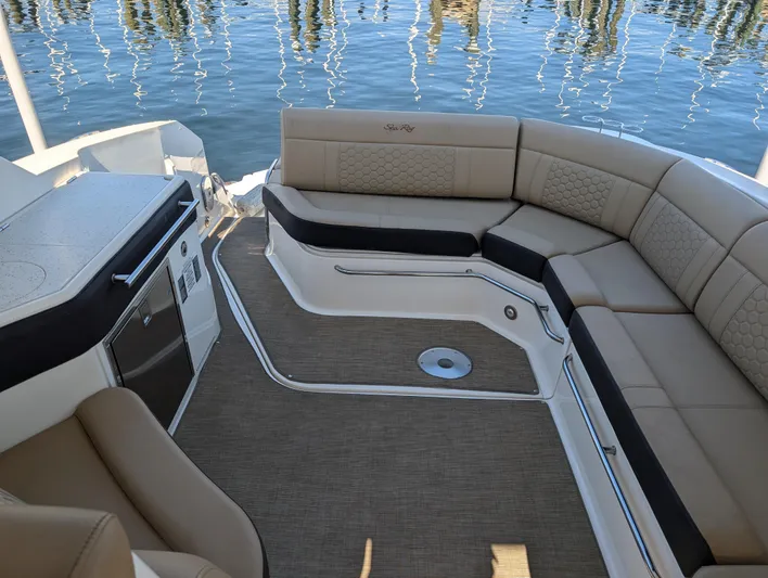  Yacht Photos Pics 2019 Sea Ray Sundancer 320 interior with beige seating and water view.