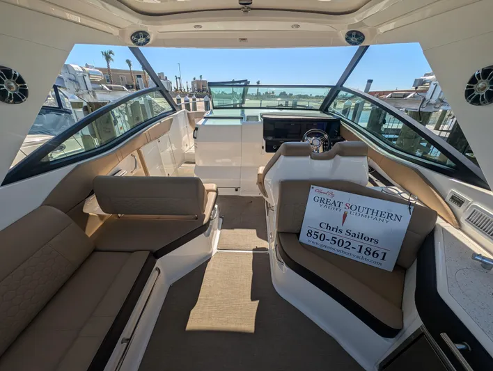  Yacht Photos Pics 2019 Sea Ray Sundancer 320 interior with seating and helm, docked at marina.