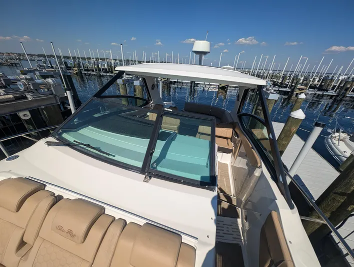  Yacht Photos Pics 2019 Sea Ray Sundancer 320 docked at marina, clear sky, calm waters.