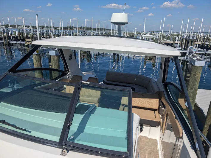  Yacht Photos Pics 2019 Sea Ray Sundancer 320 docked at marina, clear skies, calm water.
