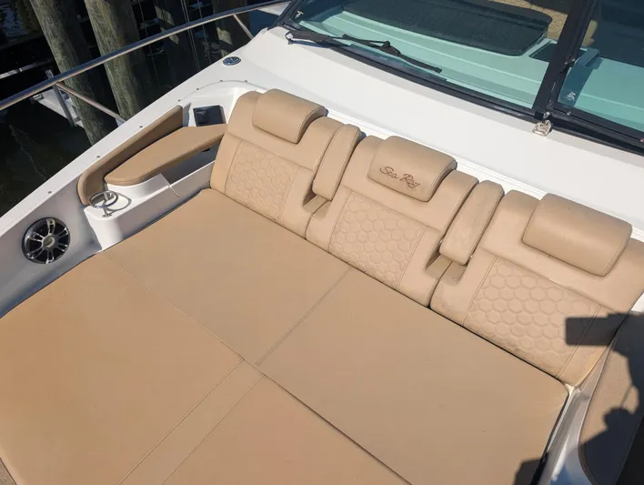  Yacht Photos Pics 2019 Sea Ray Sundancer 320 boat with beige cushioned seating area.