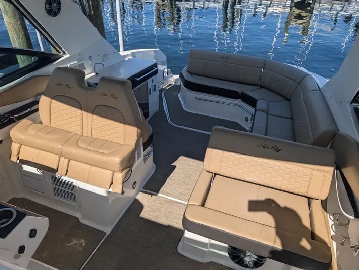  Yacht Photos Pics 2019 Sea Ray Sundancer 320 interior with tan seating and water view.